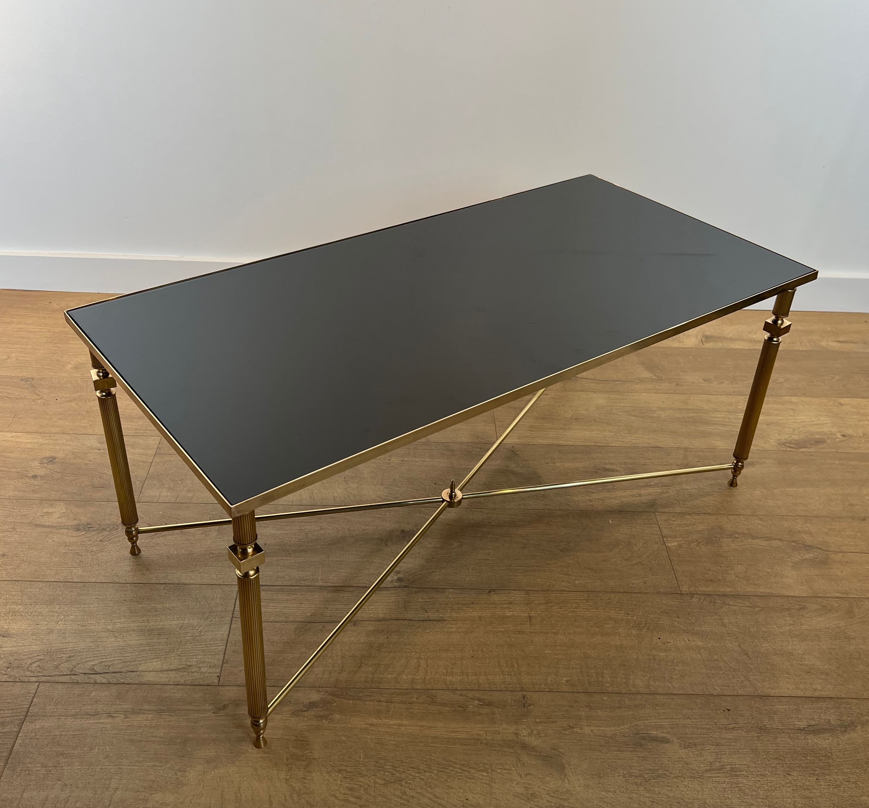 Brass Coffee table with Black Lacquered Glass Top in the style of Maison Jansen