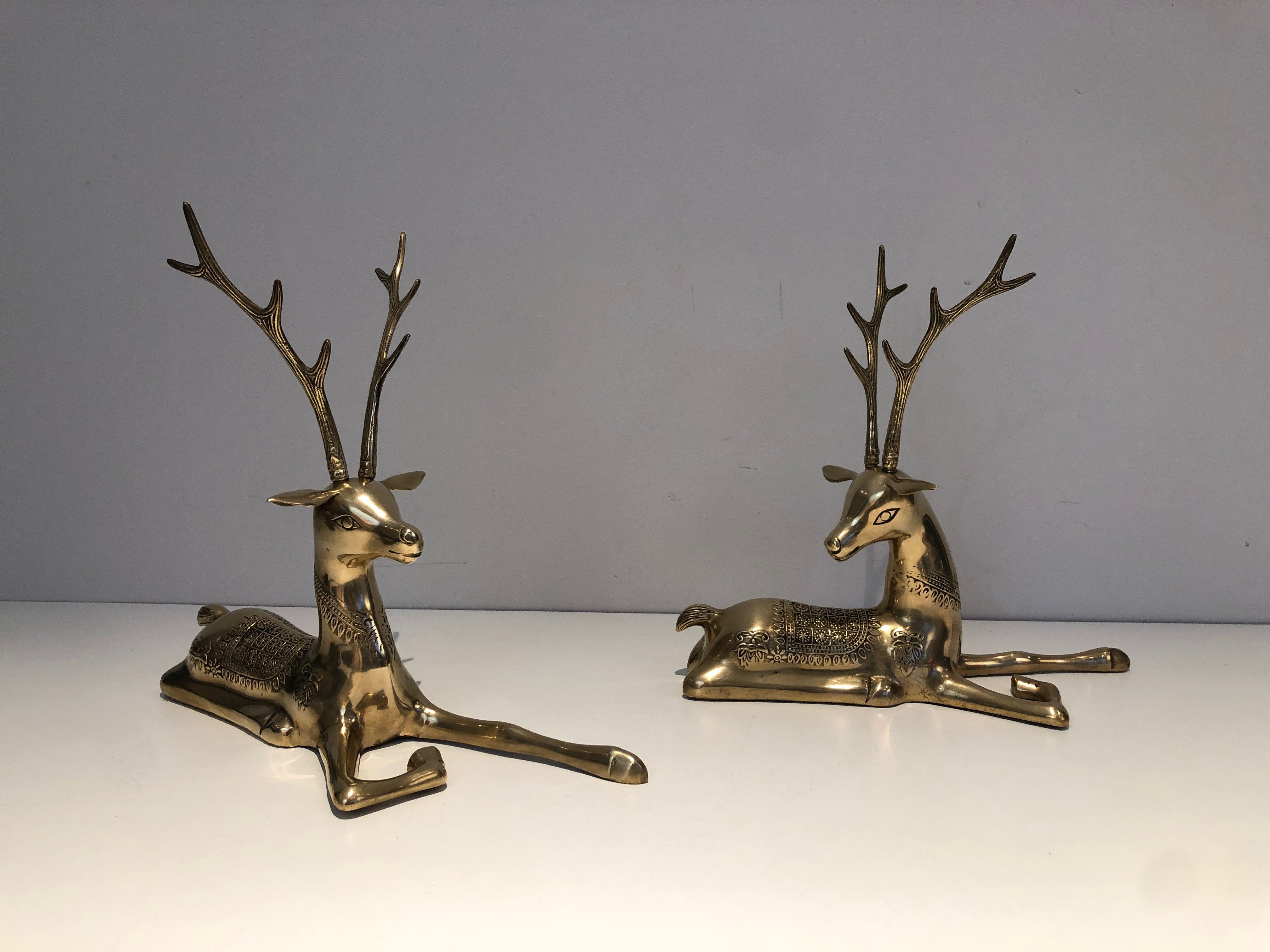 Pair of 'Resting Stags' Bronze Sculptures with Shamanic Decor, French Work, 1970s.
