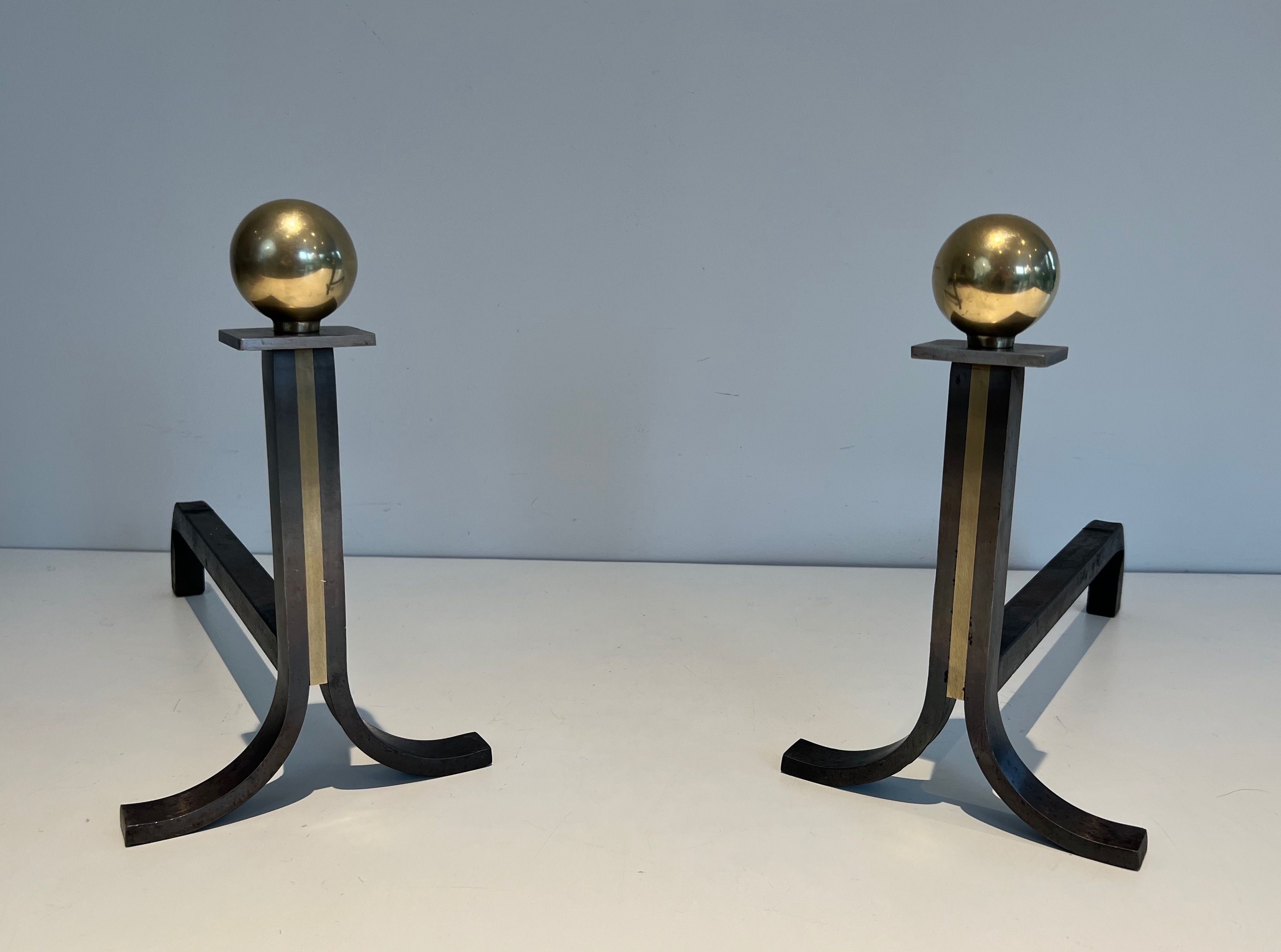 Pair of Modernist Cast Iron, Brass and Wrought Iron Andirons in the Style of Jacques Adnet