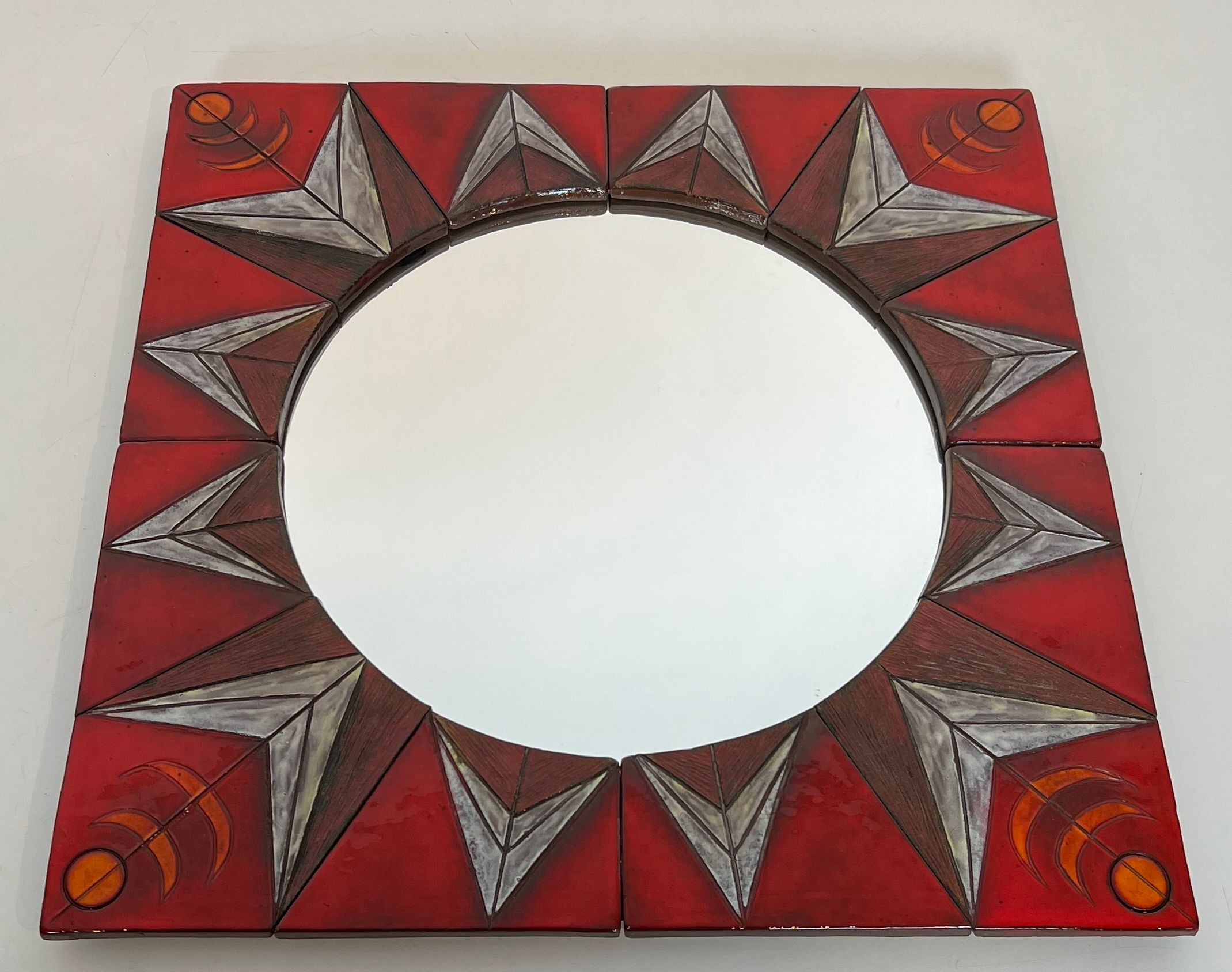 Ceramic Mirror Representing a Stylized Sun on a Red Background Attributed to Oswald Tiberghien