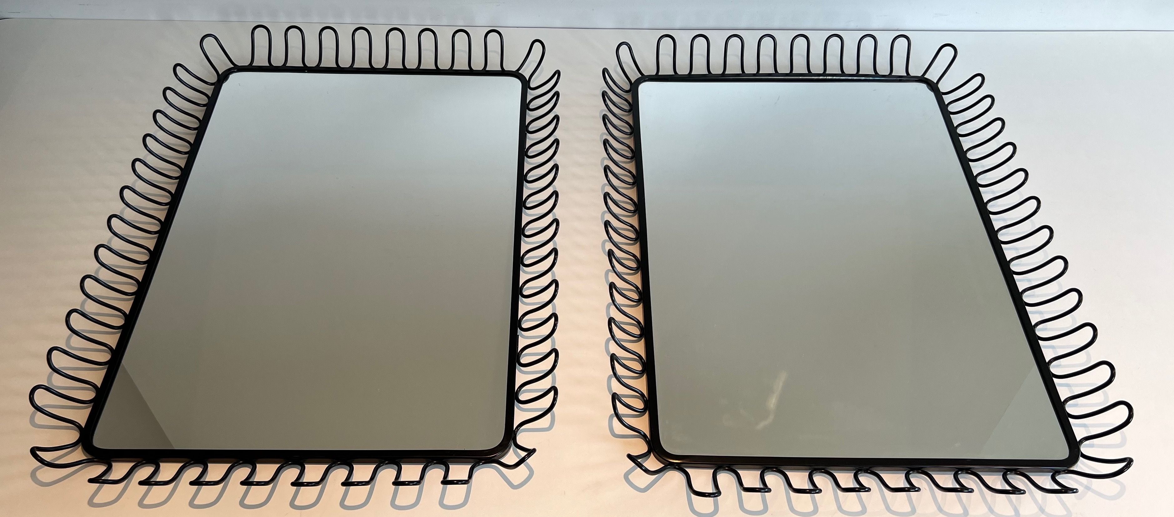 Pair of Black Lacquered Metal Mirrors in the Style of Jean Royère. Circa 1980