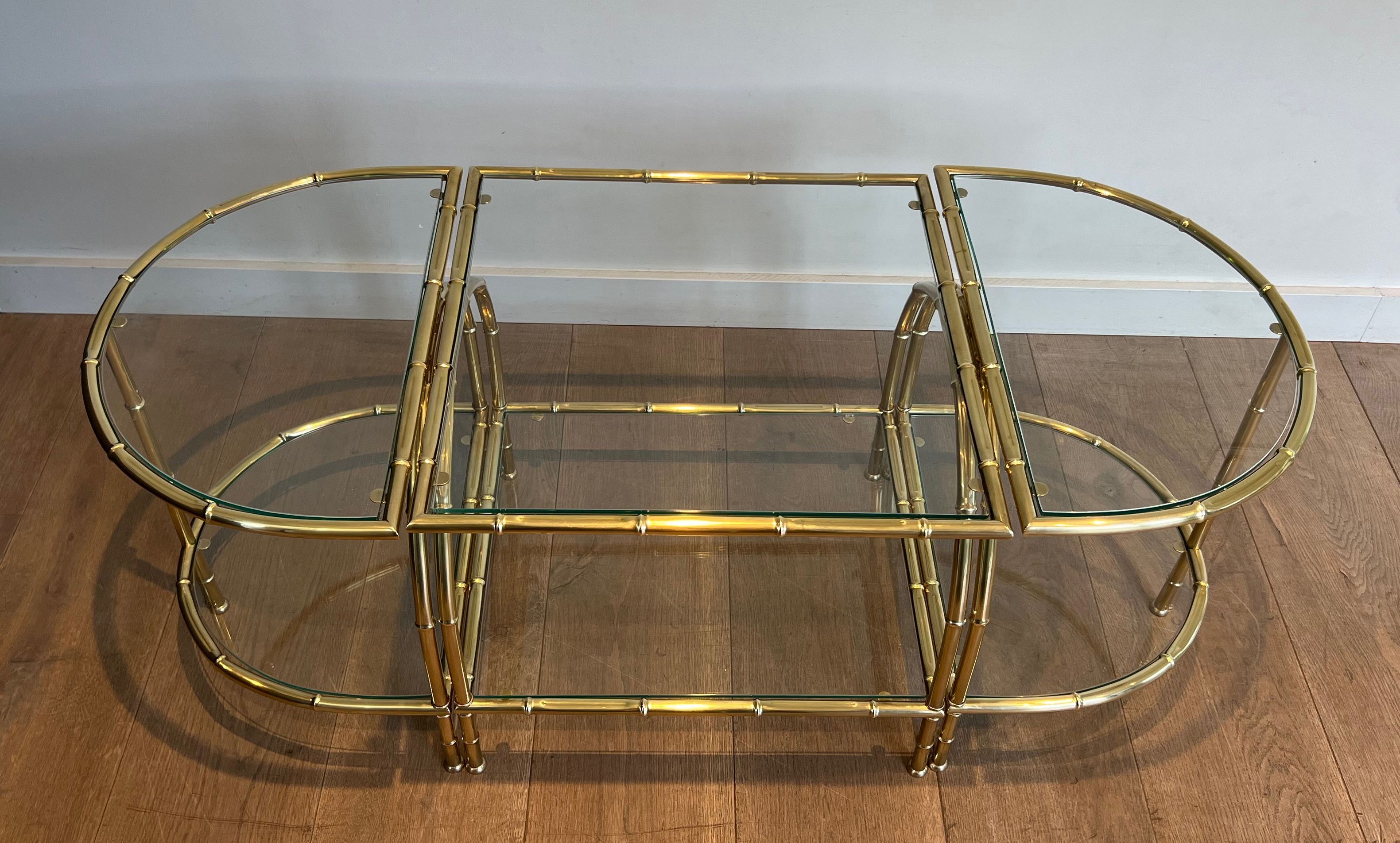 Faux-bamboo-style brass tripartite coffee table in the style of Maison Baguès
