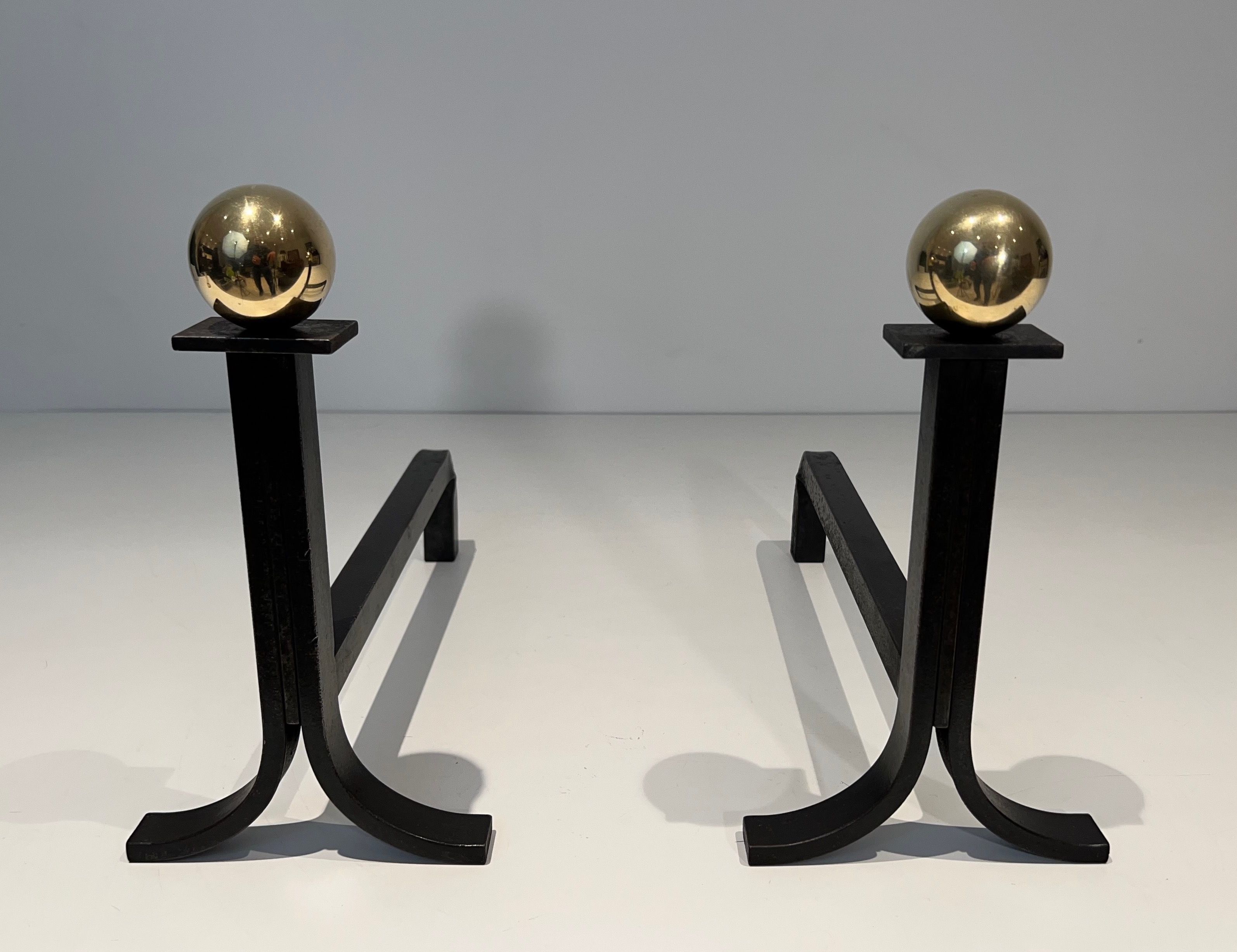 Pair of Modernist Steel, Brass and Wrought Iron Andirons in the Style of Jacques Adnet