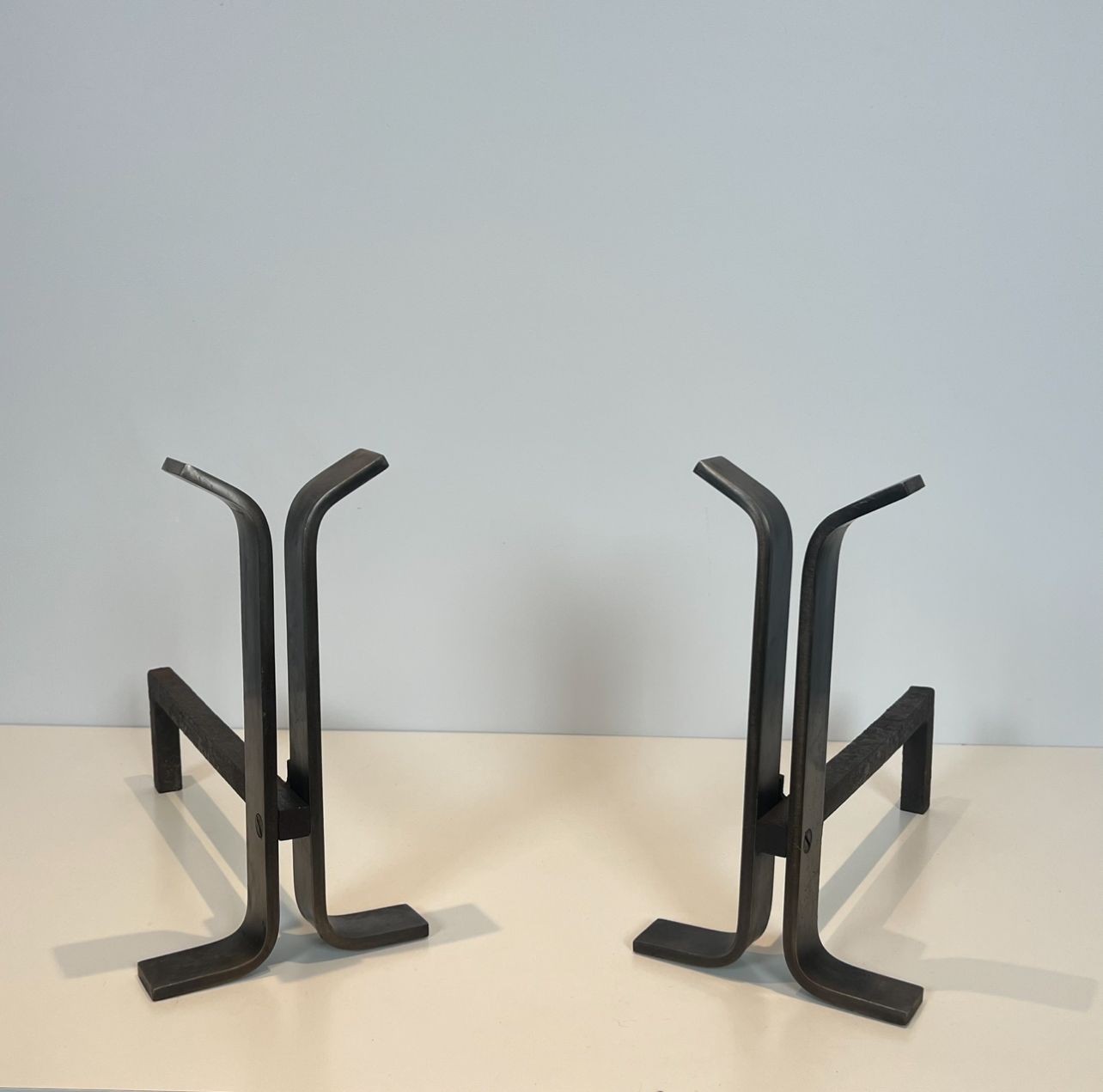 Pair of Modernist Steen and Wrought Iron Andirons