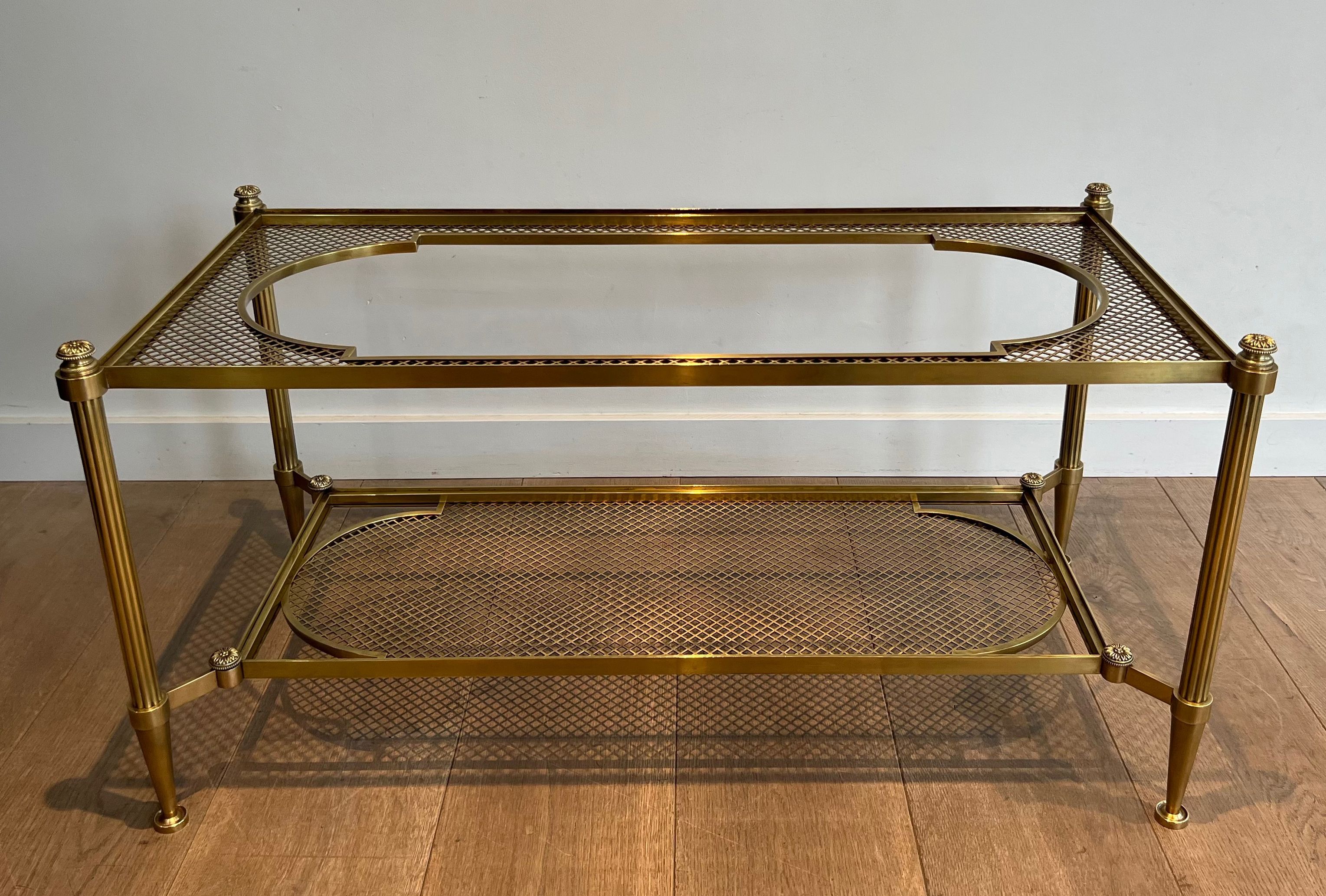 Rare Bronze and Brass Coffee Table with Two Tiers Glass Top resting on a Brass Trellis. French work by Maison Jansen