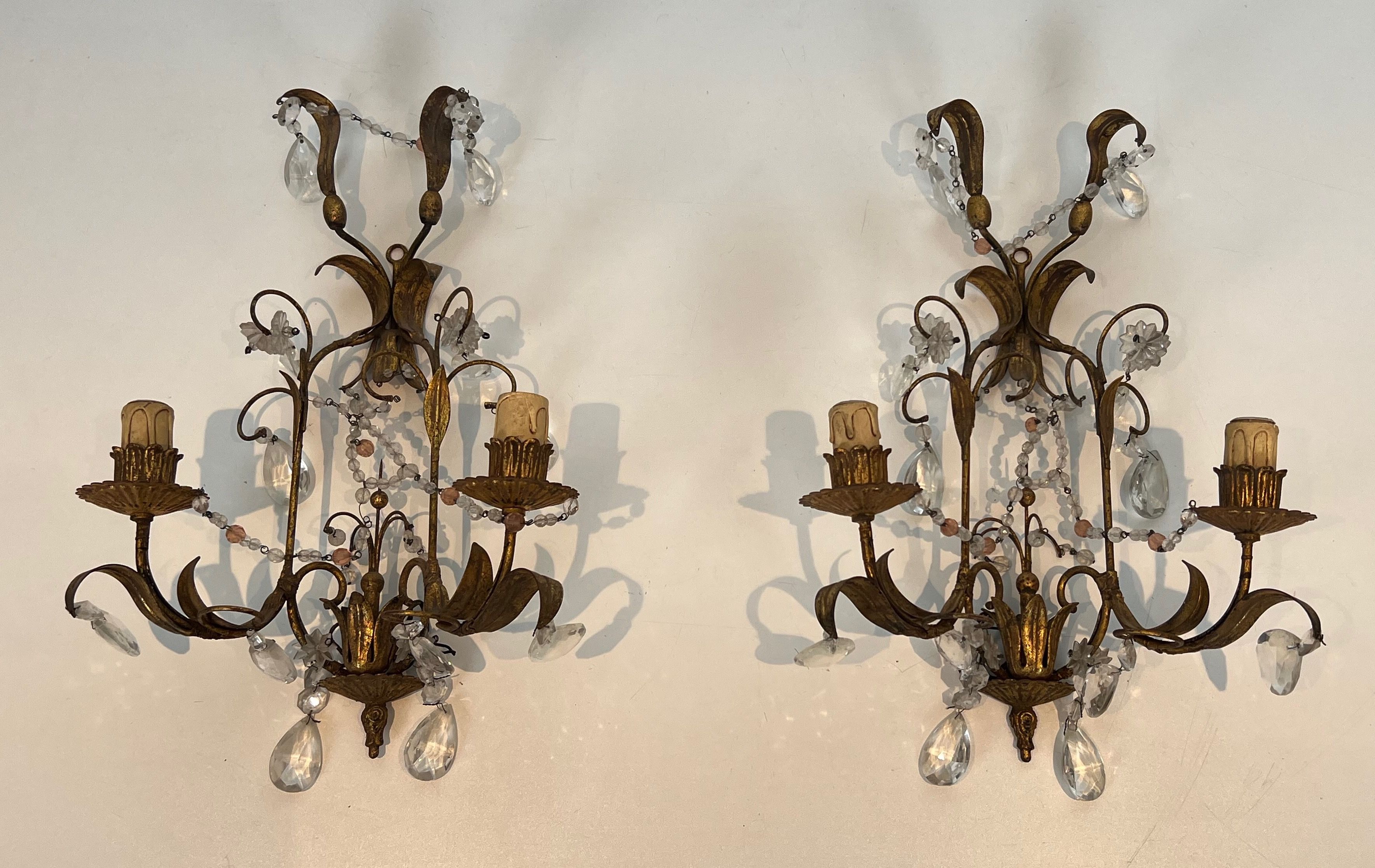 Pair of Gilded Metal and Crystals Wall Sconces in the style of Maison Baguès