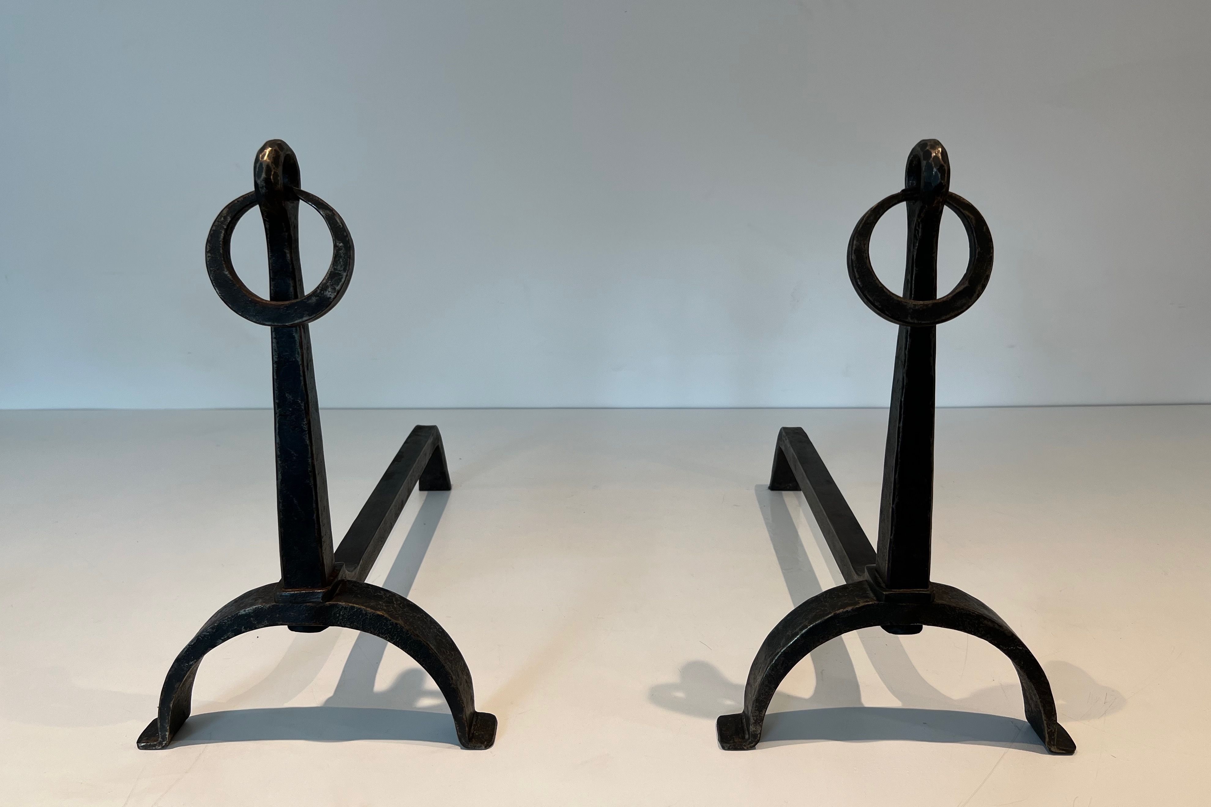 Pair of Wrought Iron Andirons in the style of Jacques Adnet