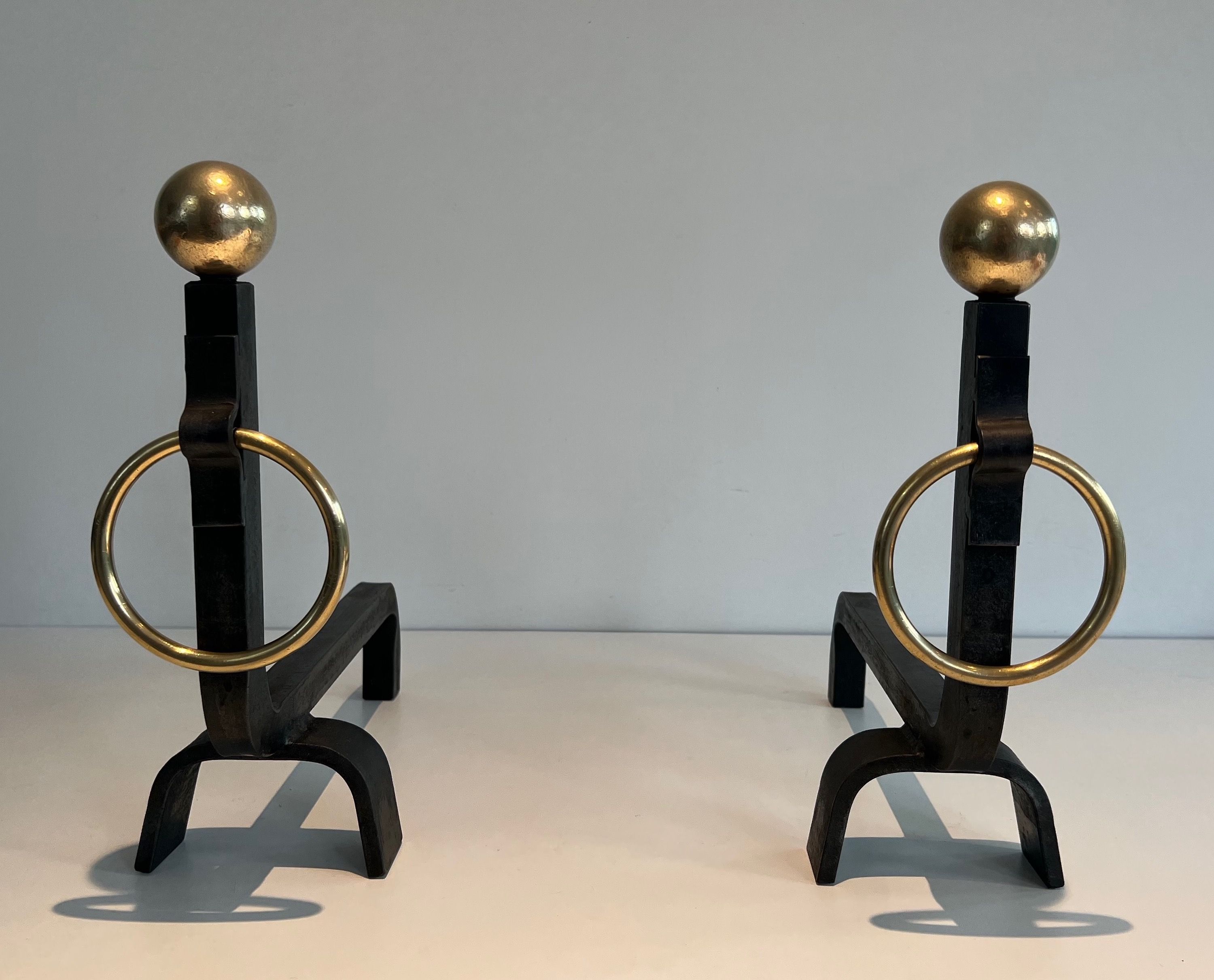 Pair of Wrought Iron and Brass Andirons in the style of Jacques Adnet