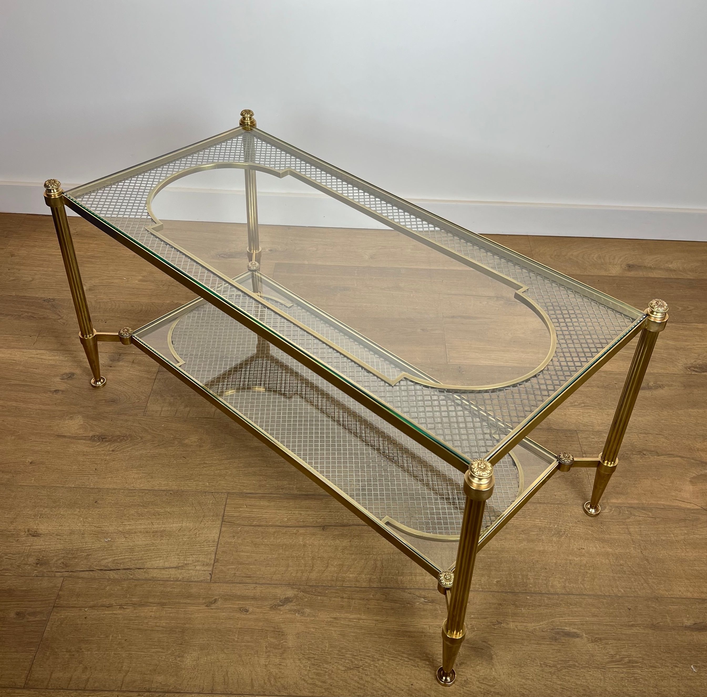 Rare Bronze and Brass Coffee Table with Two Tiers Glass Top resting on a Steel Trellis. French work by Maison Jansen