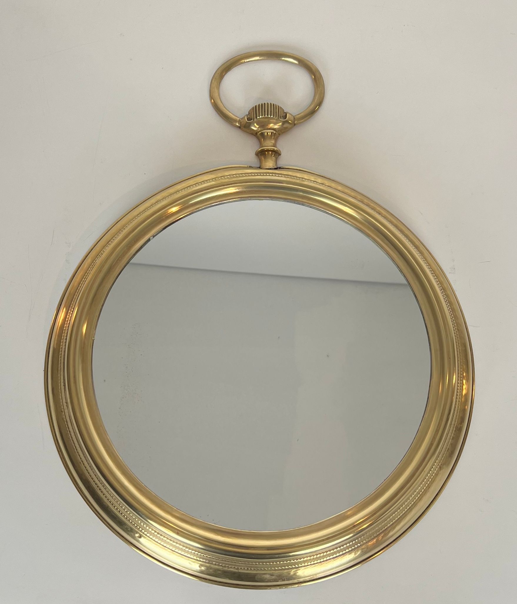 Large Brass Mirror Showing a Pocket Watch