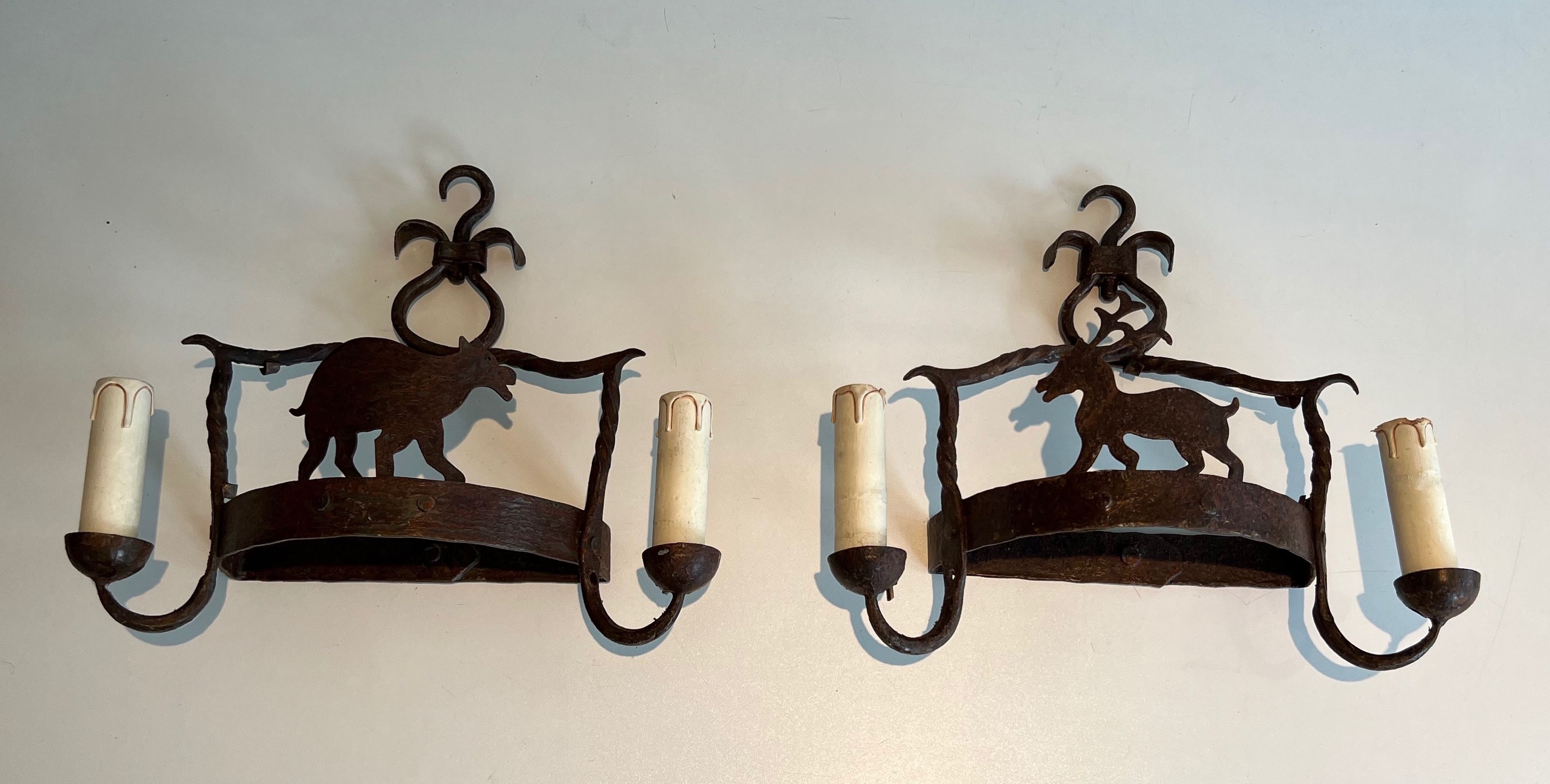 Pair of Wrought Iron Wall lights Showing Animals