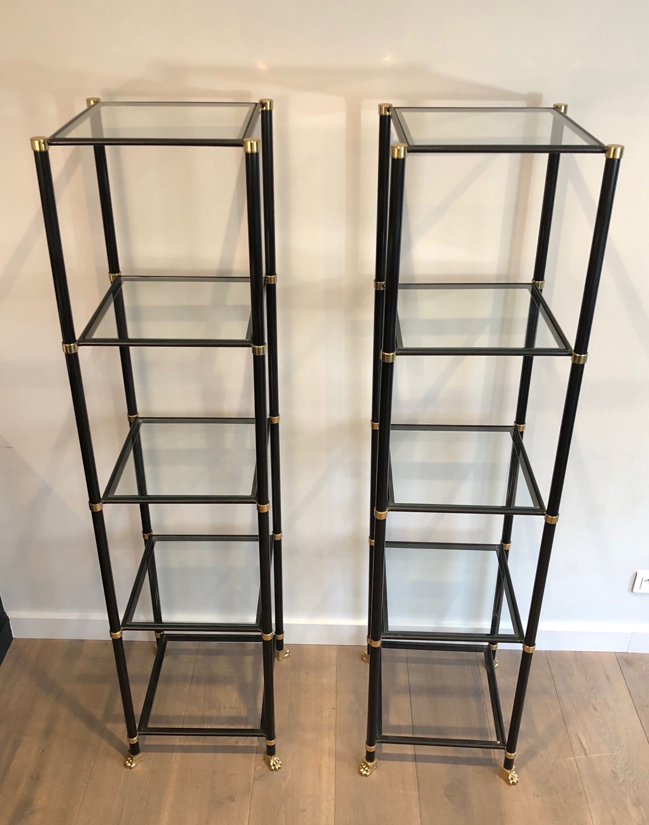 Pair of shelves in black lacquered metal, brass and bronze with claw feet. French work by Guy Lefèvre for Maison Jansen. Circa 1970