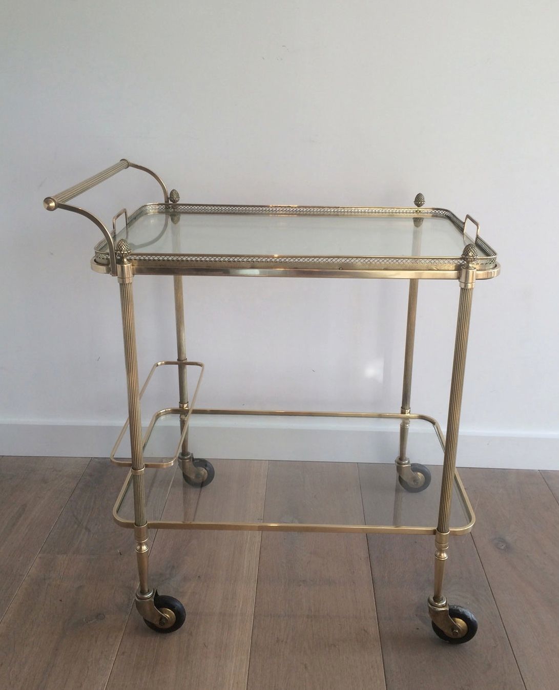 Neoclassical brass drinks trolley by Maison Bagués. Circa 1940
