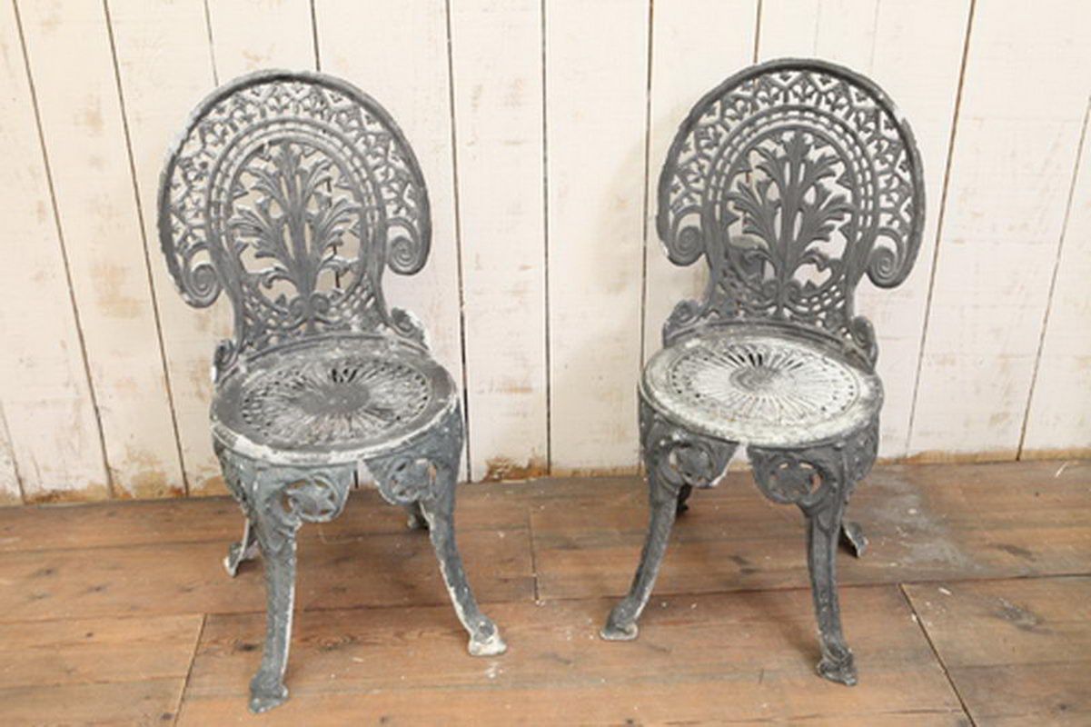 Pair of cast aluminium garden chairs
