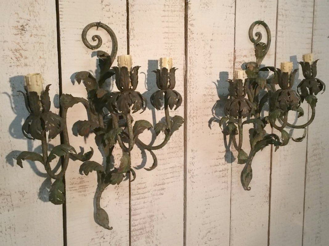 Pair of decorative painted metal wall sconces. Circa 1940