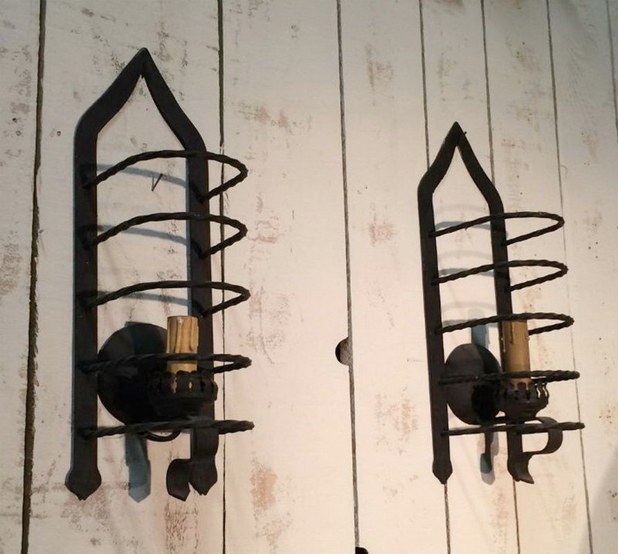 Unusual pair of wrought iron cage wall sconces. Circa 1950