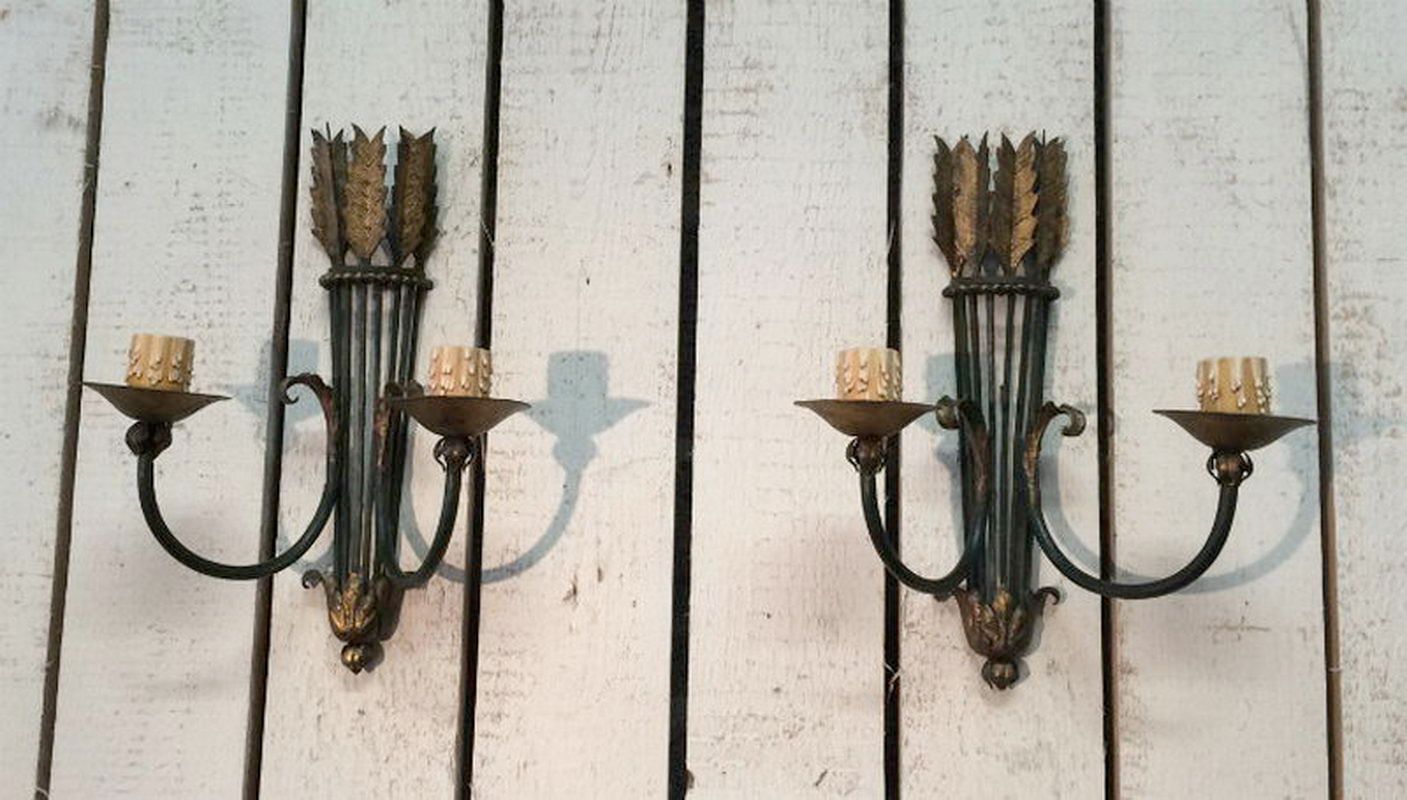 Beautiful pair of wrought iron wall sconces. Circa 1940