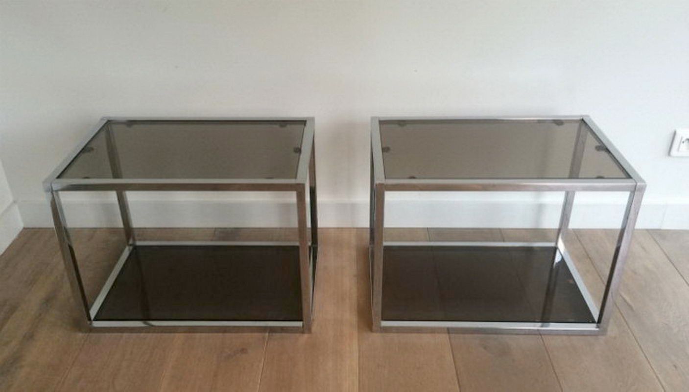 Pair of chrome side tables with smoked glasses