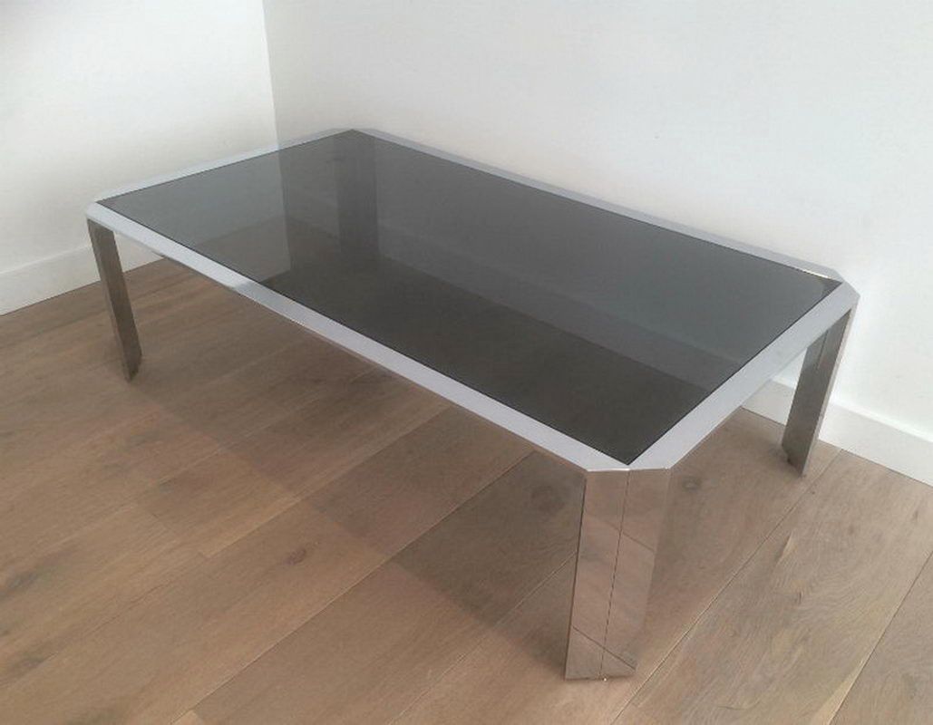 Nice octogonal chromed coffee table with black glass top