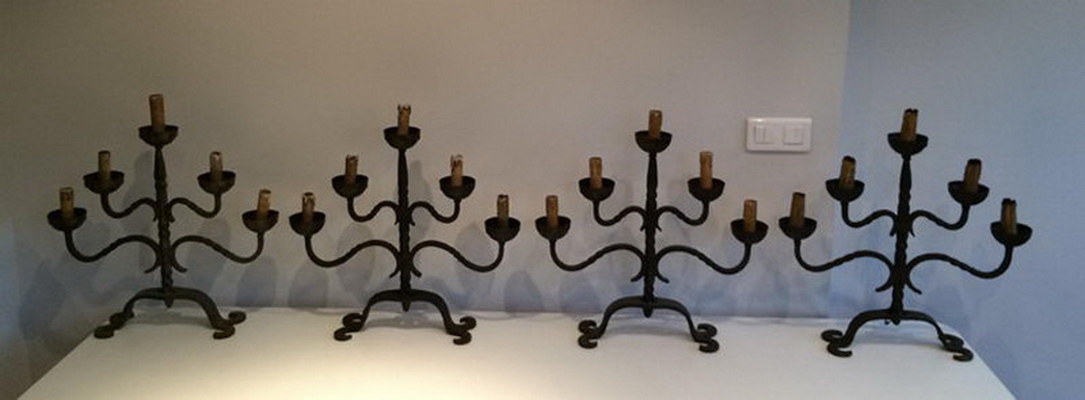 Set of 4 wrought iron candlesticks