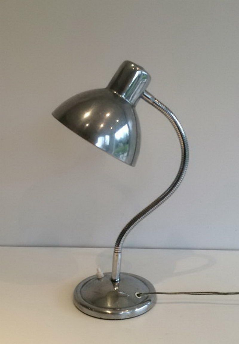 Swinging chrome lamp