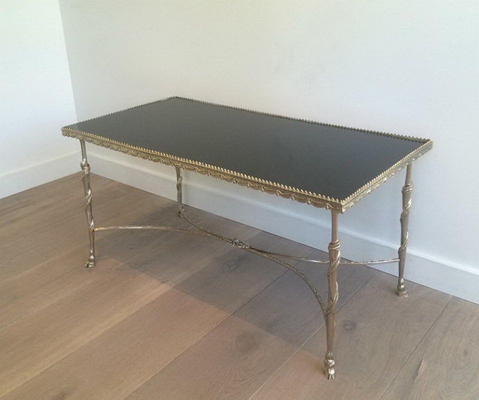 Silver coffee table with animal feet and black lacquered glass top