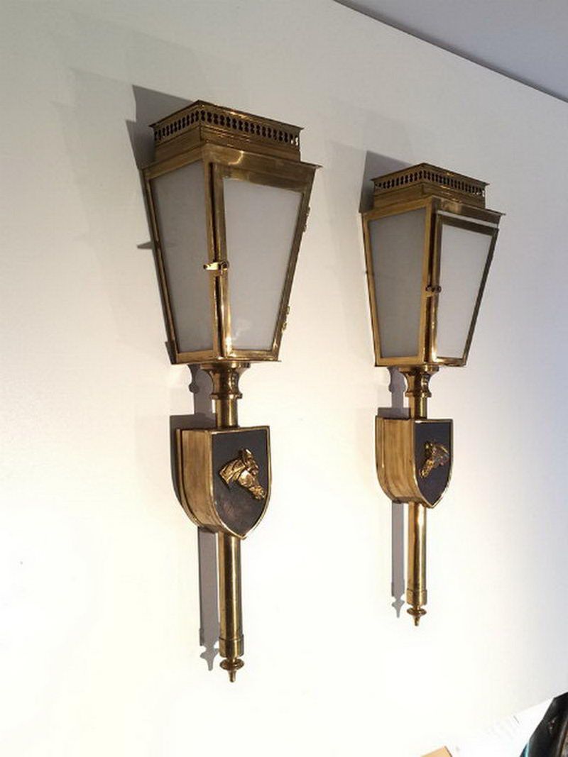 Pair of horses brass, black lacquered and glass lanterns