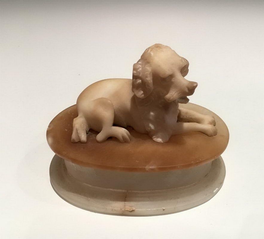 Stone candy box with a King-Charles dog