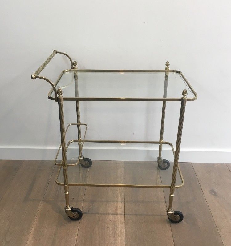 Neoclassical brass drinks trolley by Maison Bagués. Circa 1940