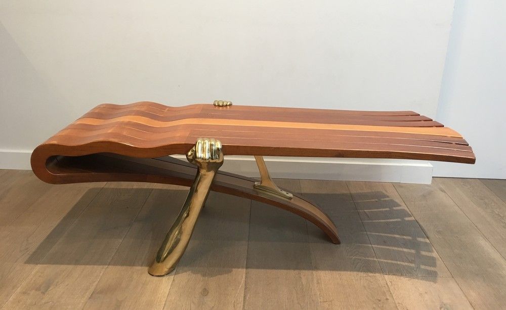 Unique Coffee Table Made of a Thick Free Form Wood Top Supported by 2 Gilt Brass Arms