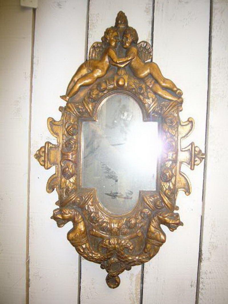 gilt wood mirror with cherubs