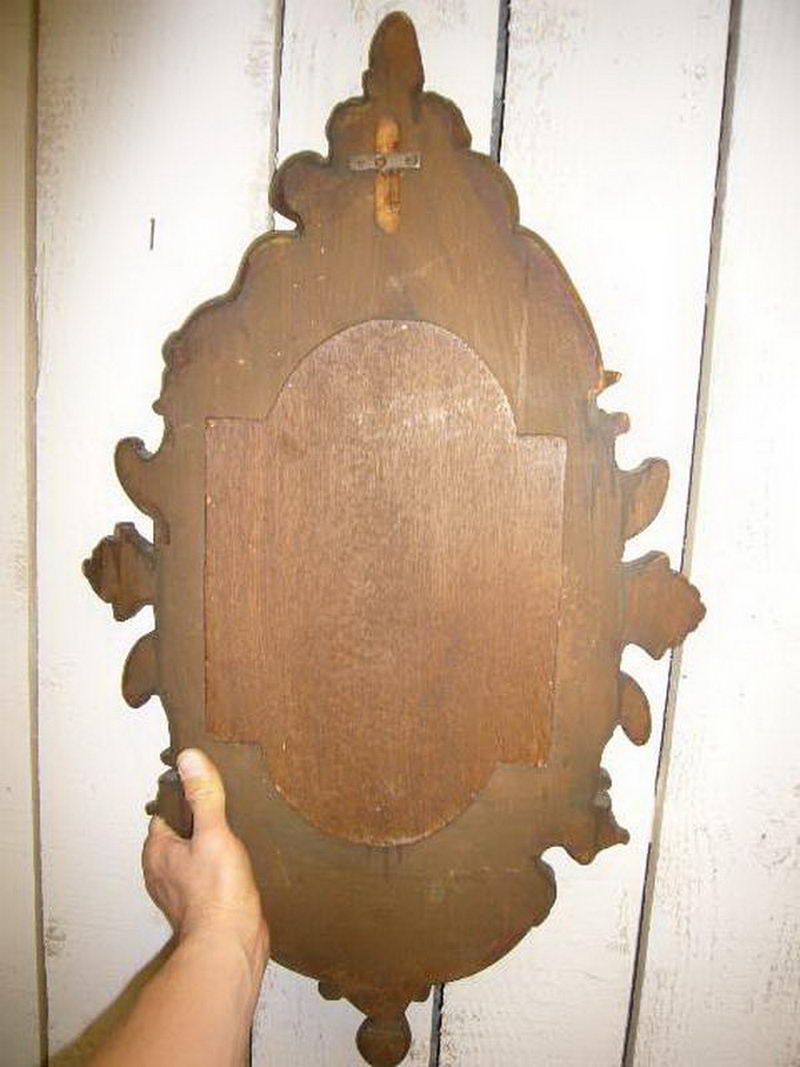 Miroir en bois doré aux chérubins