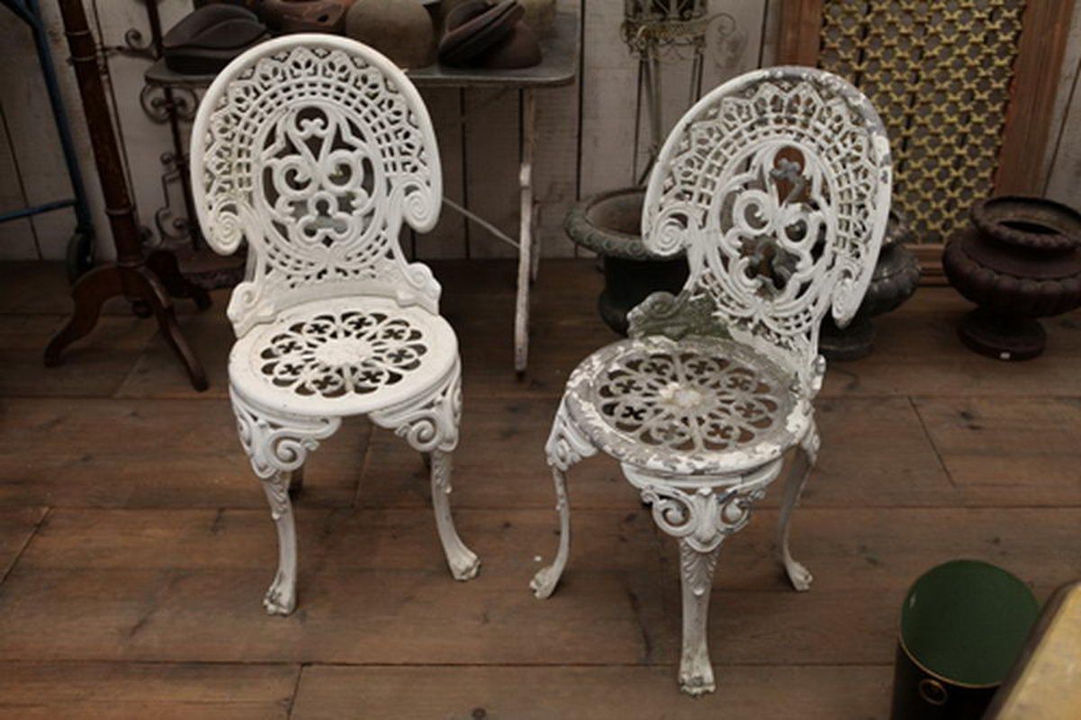 Pair of cast aluminium garden chairs with original paint